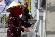در ویتنام دستگاه های خودپردازی نصب شد که به جای پول برنج می‌دهد+تصاویر