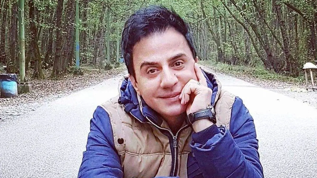 داریوش فرضیایی در آغوش کودک توان یاب /عکس