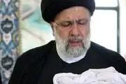 اذان‌گفتن رئیسی در گوش نوزاد کرجی