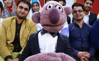 عروسک جناب خان در کیف بازیکن ملی پوش
