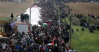 ساکنان غزه راهپیمایی پرچم برگزار می کنند