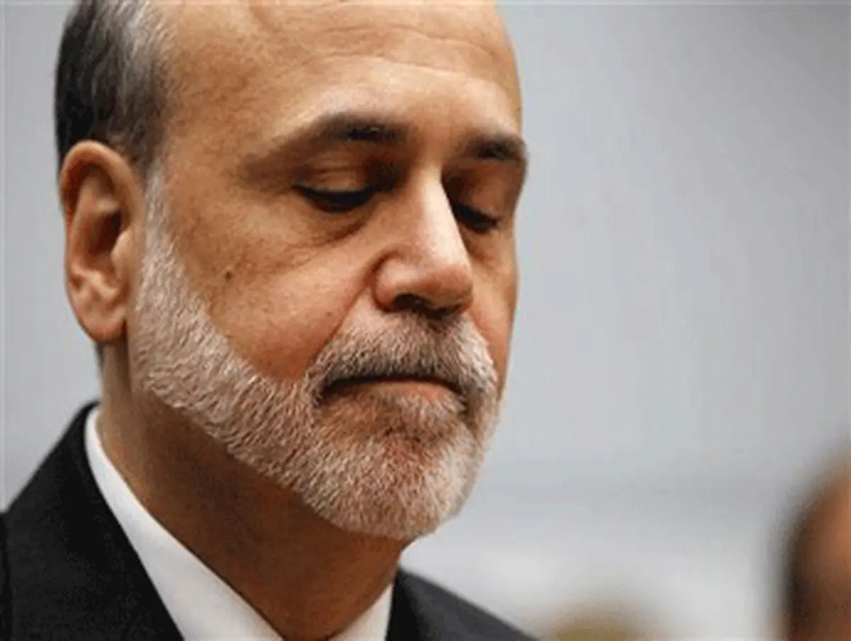 Fed says economy may need help, keeps policy on hold