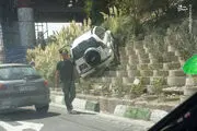 پرواز یک خودرو در تهران/ عکس
