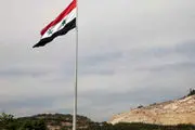 اهتزاز پرچم سوریه در اردوگاه یرموک